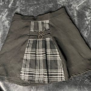Black and plaid skirt. Heart buckles. Small from Romwe